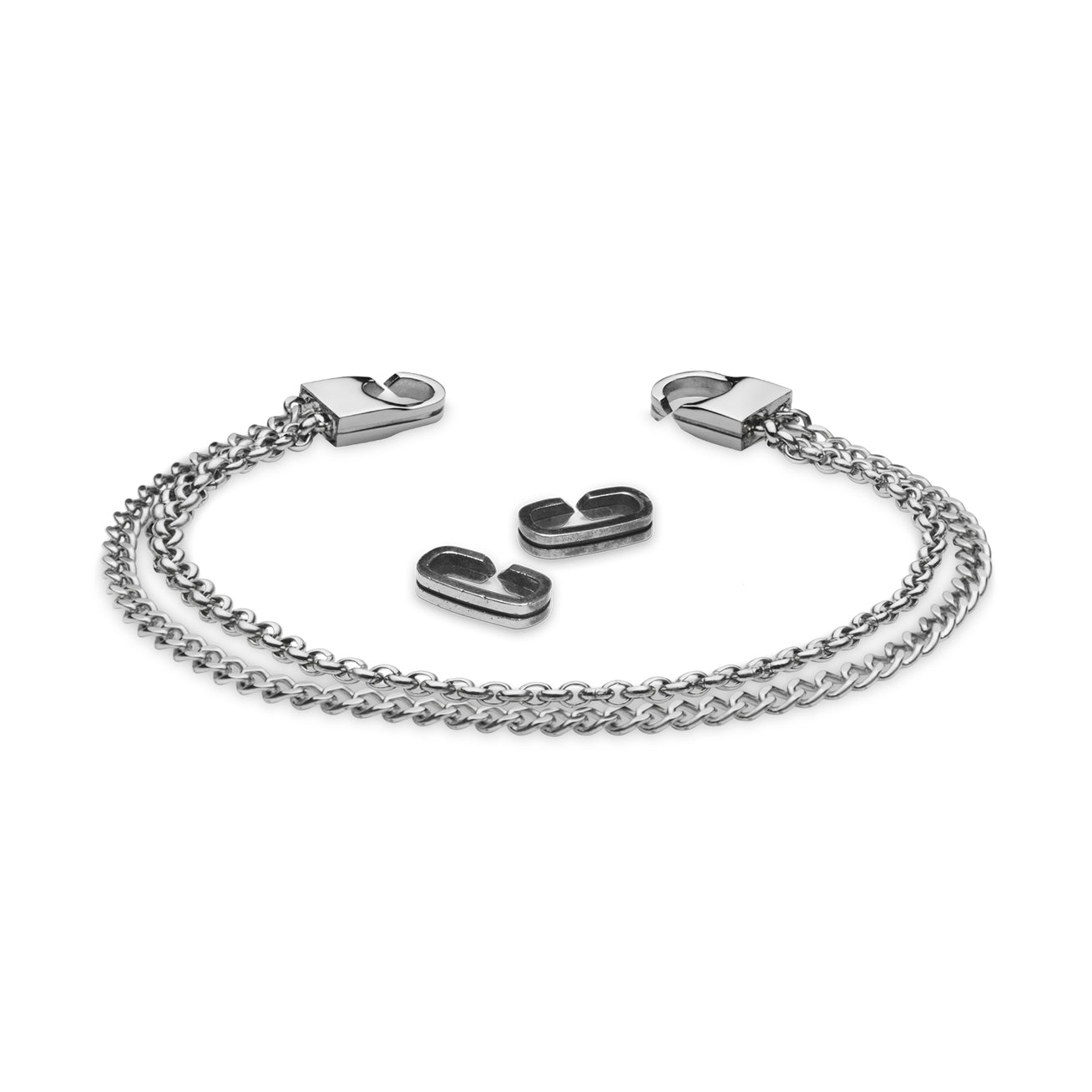 Two BANE - Polished silver chain bracelets by Armor of the Free, featuring large clasps and strap-inspired details, are displayed with two matching metal links on a plain white background.
