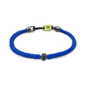The ILYA - Blue by Armor of the Free is a single blue strap bracelet with a metal bead and yellow rectangular clasp.